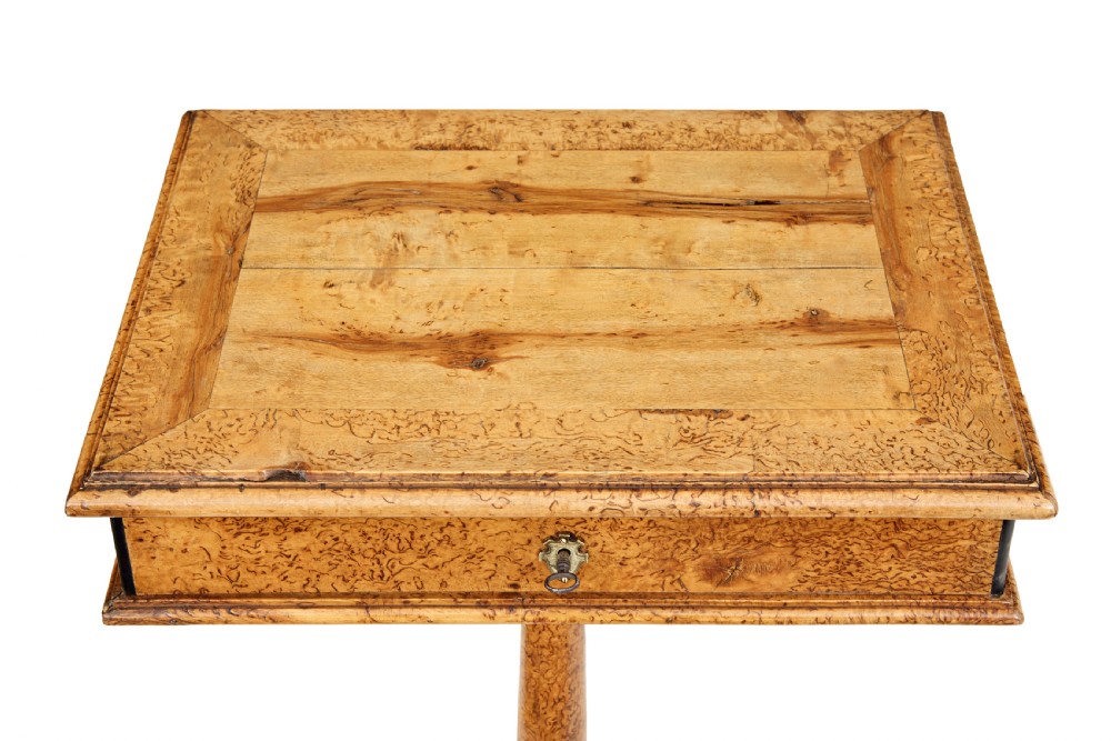 A mid-19th-century Swedish burr birch work table featuring a rectangular top, single drawer with keyhole escutcheon, turned central pedestal, and tripod legs. View II