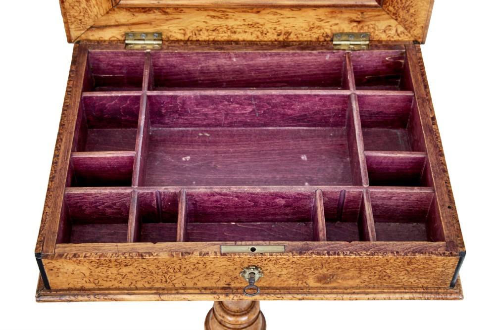 A mid-19th-century Swedish burr birch work table featuring a rectangular top, single drawer with keyhole escutcheon, turned central pedestal, and tripod legs. View V