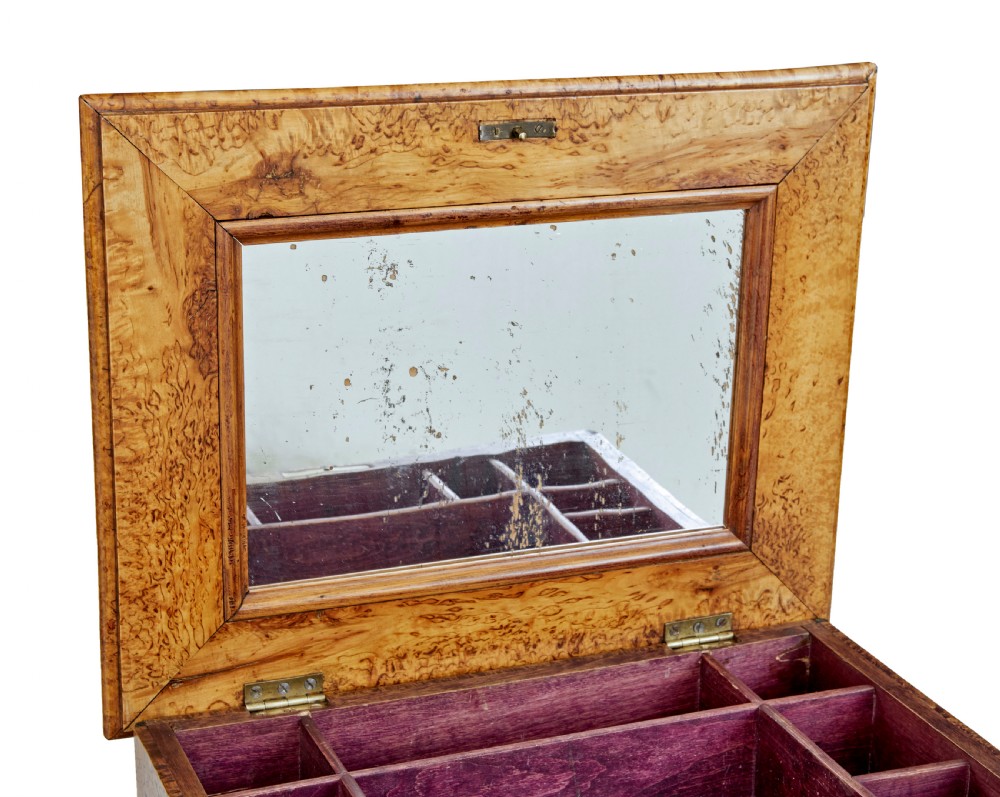 A mid-19th-century Swedish burr birch work table featuring a rectangular top, single drawer with keyhole escutcheon, turned central pedestal, and tripod legs. View VI
