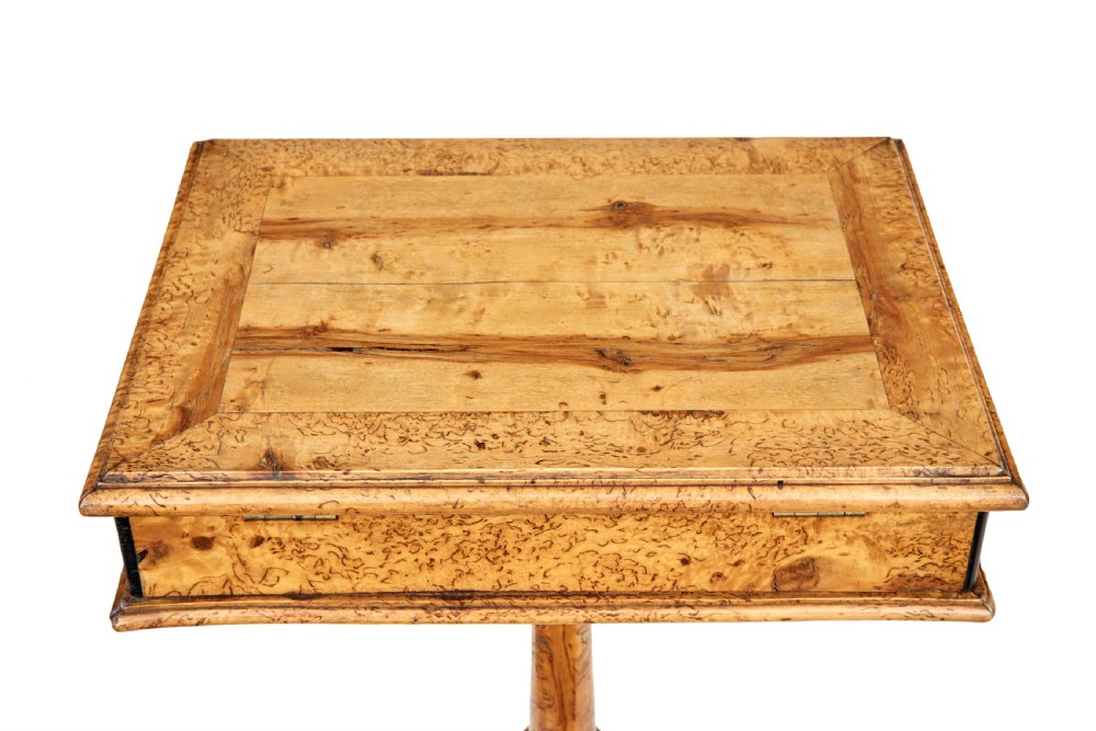 A mid-19th-century Swedish burr birch work table featuring a rectangular top, single drawer with keyhole escutcheon, turned central pedestal, and tripod legs. View VII