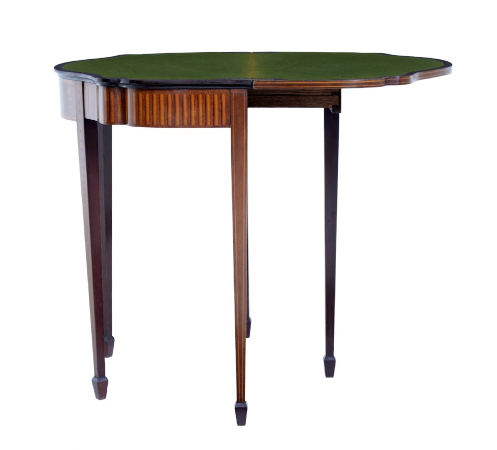 A 19th-century Sheraton Revival mahogany card table featuring a demi-lune fold-over top, satinwood marquetry with urn and swag motifs, and four tapered square legs. View VIII