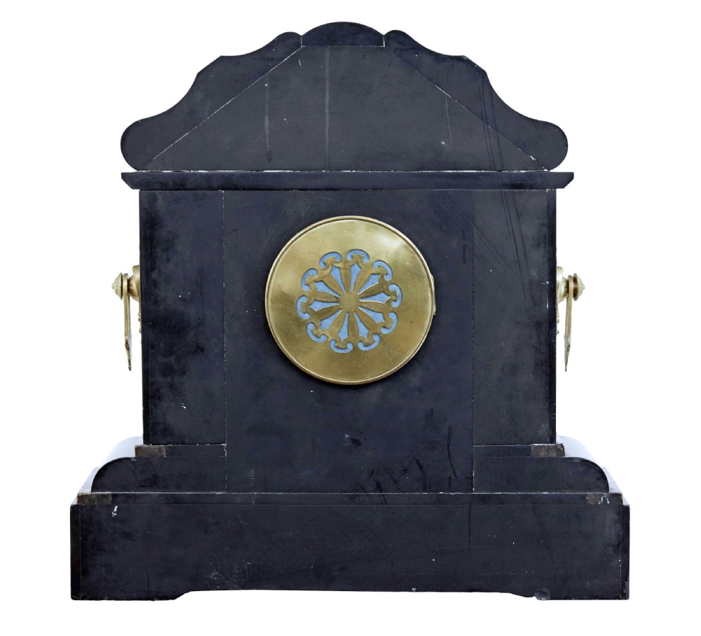 A High Victorian black marble mantel clock featuring gold incised scrollwork, a classical cherub relief panel, and a central circular dial with Roman numerals. View IV