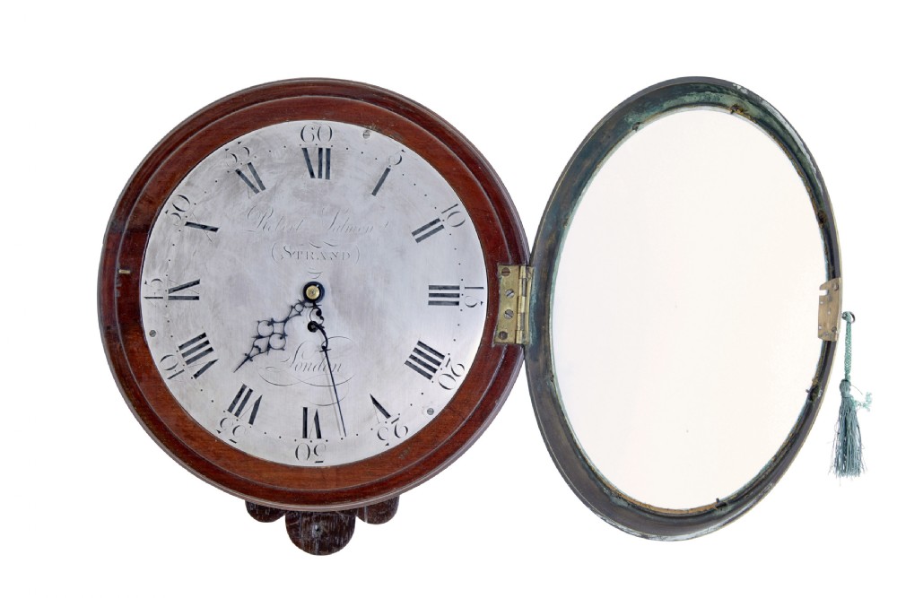 An 18th-century Georgian wall clock featuring an engraved silvered dial with Roman numerals, a brass bezel, and a circular mahogany surround. View III