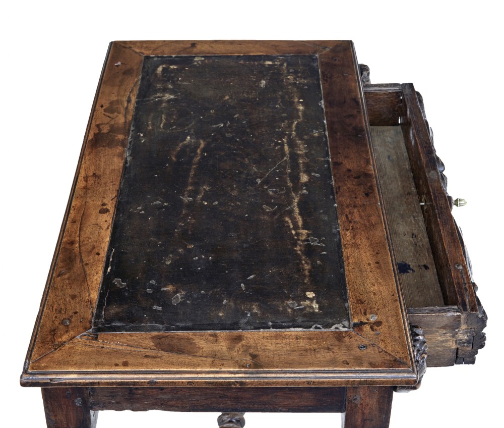 An early 19th-century Flemish carved walnut side table featuring barley twist legs, a carved frieze drawer with corner masks, and a low twist stretcher. View VII