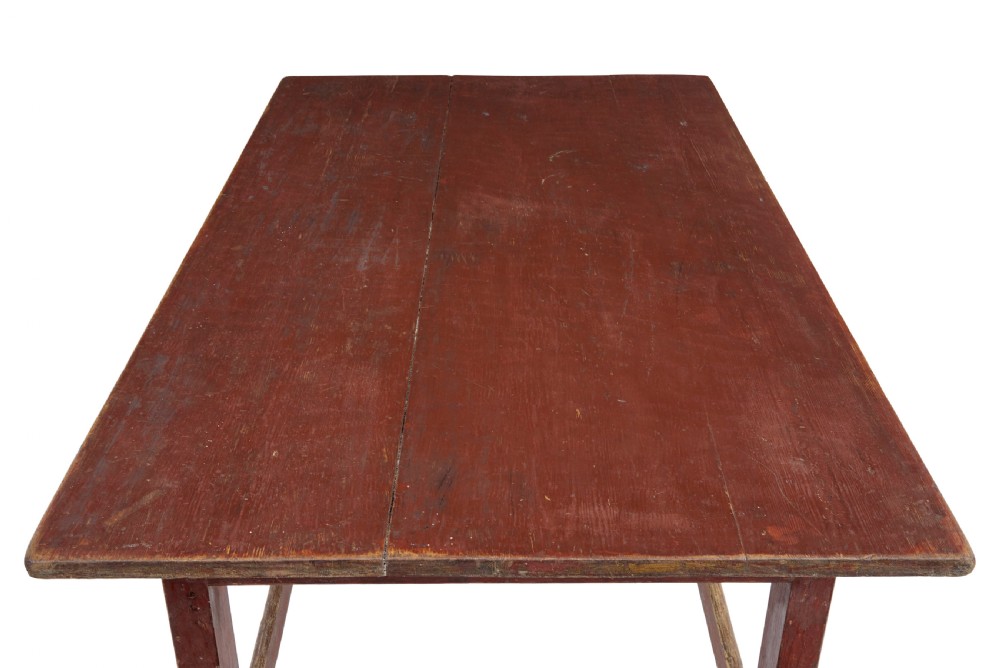 A large 19th-century Scandinavian pine table with a red-painted finish, rectangular plank top, and lower box stretcher. View II