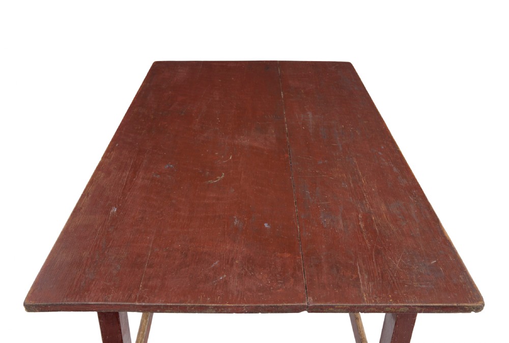 A large 19th-century Scandinavian pine table with a red-painted finish, rectangular plank top, and lower box stretcher. View III