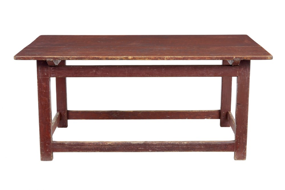 A large 19th-century Scandinavian pine table with a red-painted finish, rectangular plank top, and lower box stretcher. View V