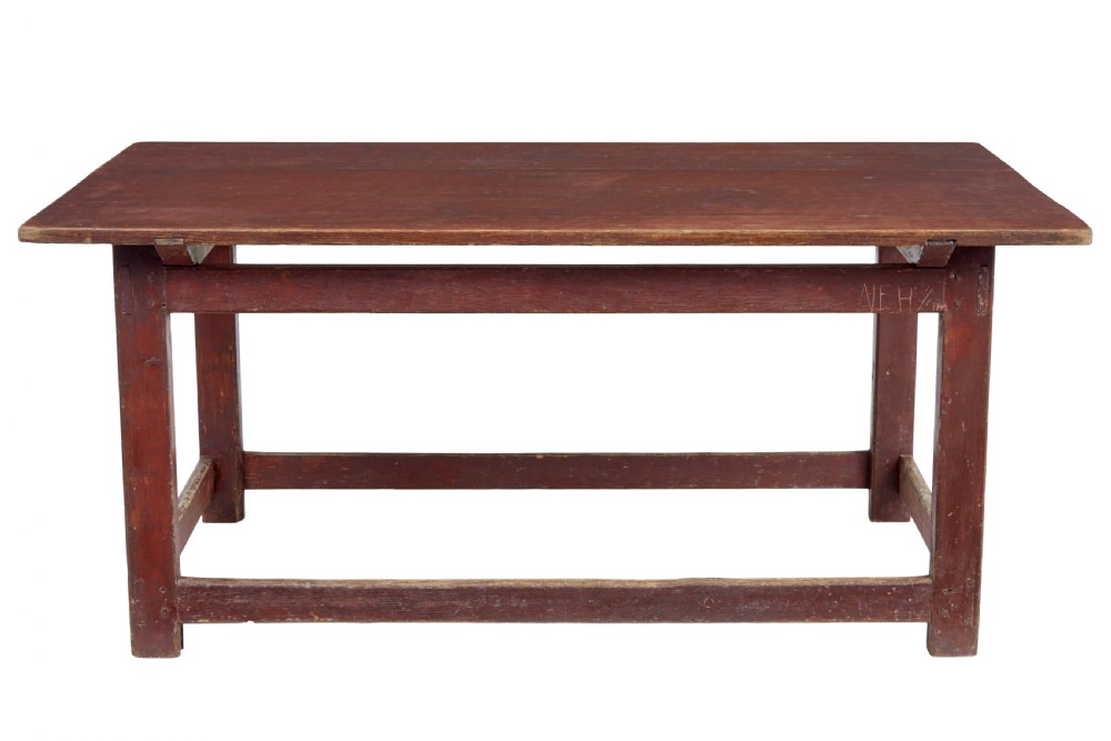 A large 19th-century Scandinavian pine table with a red-painted finish, rectangular plank top, and lower box stretcher. View VII