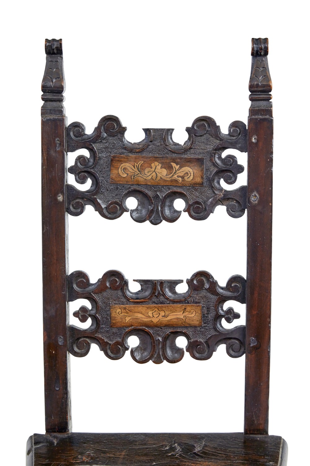 A pair of 19th-century dark oak Carolean-inspired hall chairs featuring intricate scrollwork carving, inlaid back panels, and turned finials. View VIII