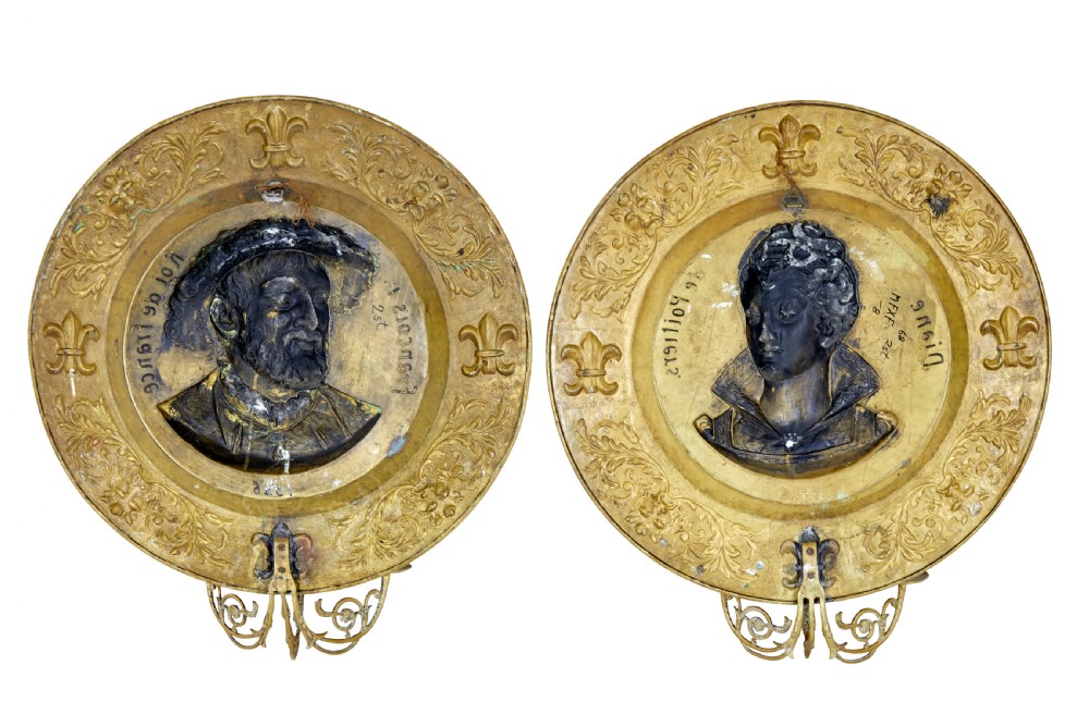 A pair of circular 19th-century French brass wall sconces featuring central relief portraits of Diane de Poitiers and King Francois I, adorned with fleur-de-lis motifs and three candle branches each. View VIII