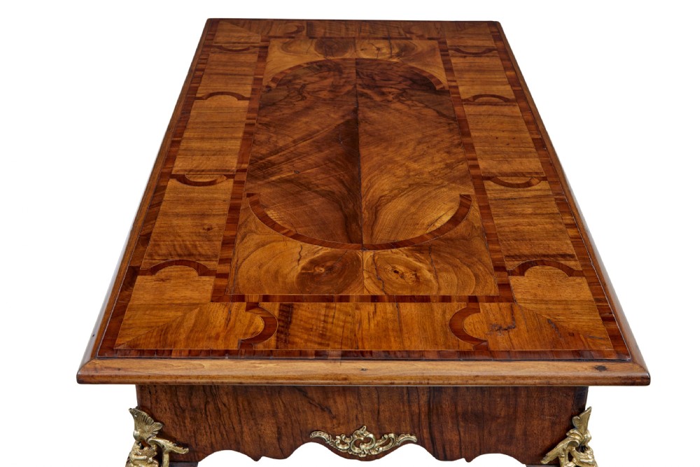 A 19th-century Rococo Revival walnut side table featuring inlaid marquetry on the top, curved cabriole legs, and ornate gilt-bronze ormolu mounts. View II