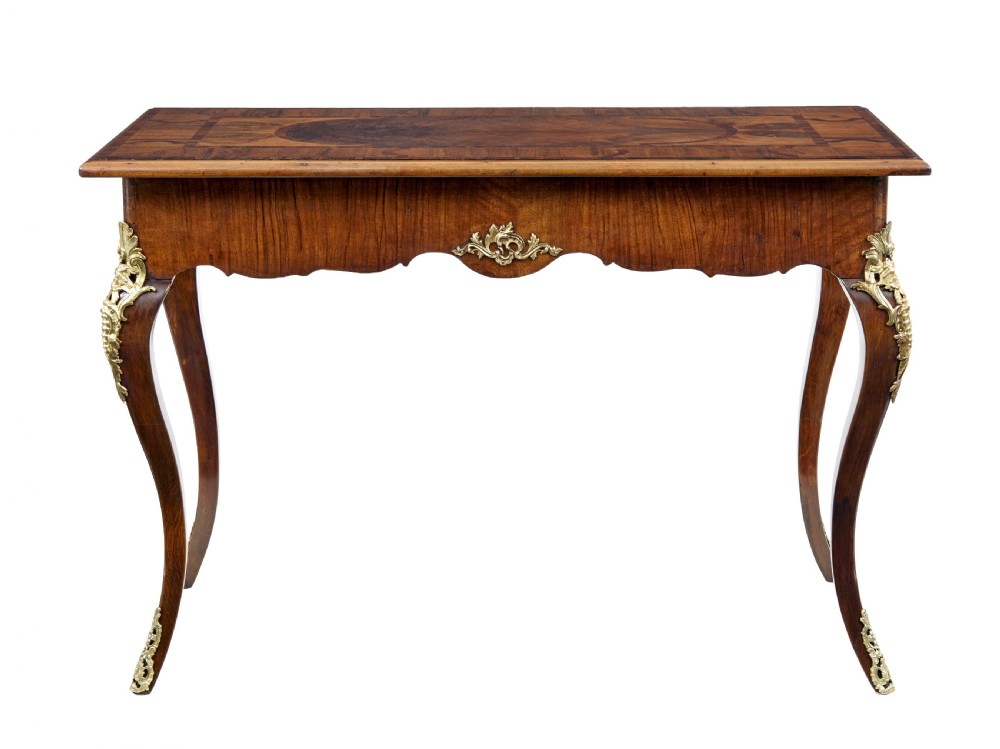 A 19th-century Rococo Revival walnut side table featuring inlaid marquetry on the top, curved cabriole legs, and ornate gilt-bronze ormolu mounts. View V