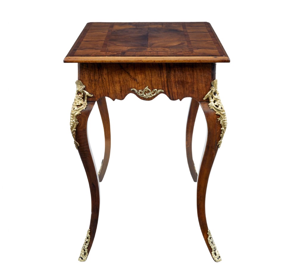 A 19th-century Rococo Revival walnut side table featuring inlaid marquetry on the top, curved cabriole legs, and ornate gilt-bronze ormolu mounts. View VI