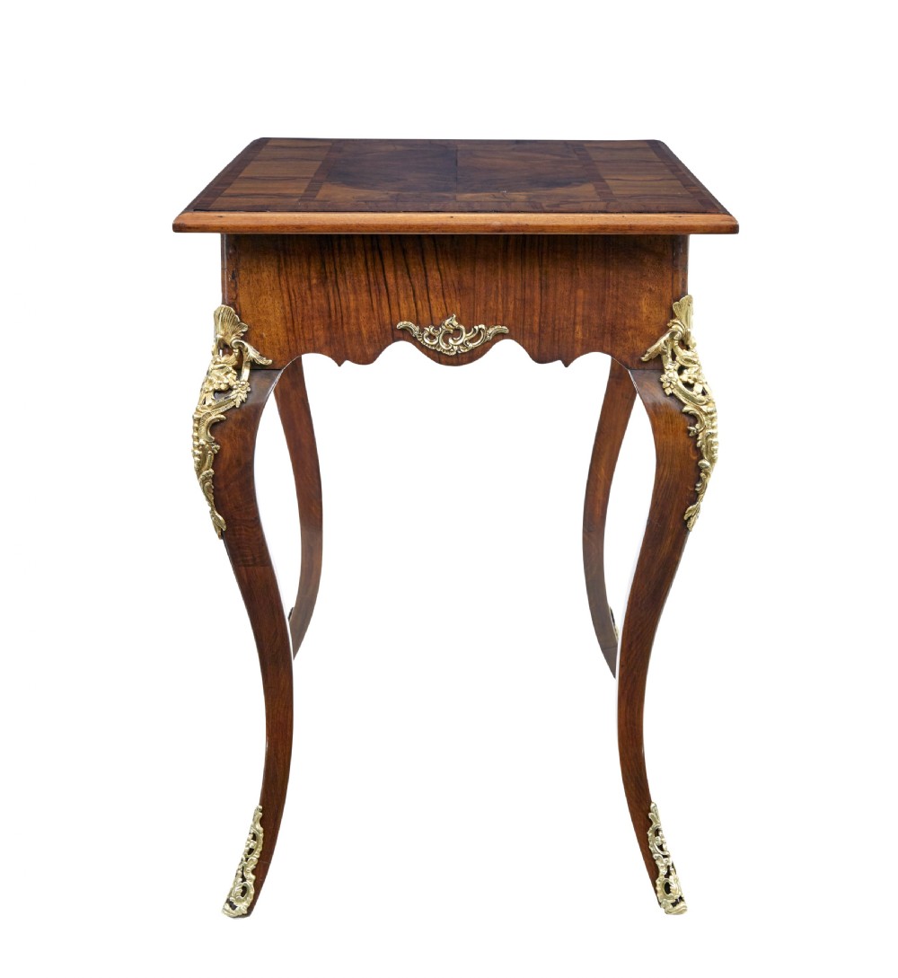 A 19th-century Rococo Revival walnut side table featuring inlaid marquetry on the top, curved cabriole legs, and ornate gilt-bronze ormolu mounts. View VIII