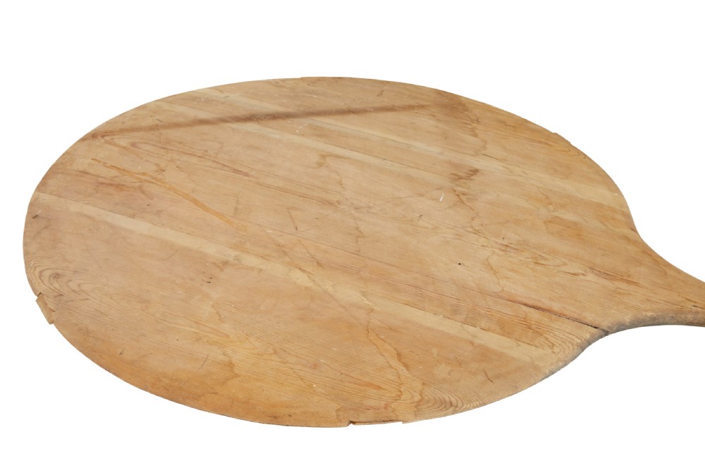 A large 19th-century Scandinavian pine baker peel with a long slender handle and a wide circular paddle head. View II