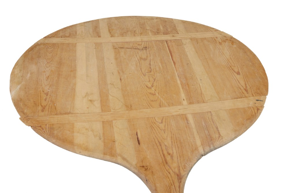 A large 19th-century Scandinavian pine baker peel with a long slender handle and a wide circular paddle head. View VI