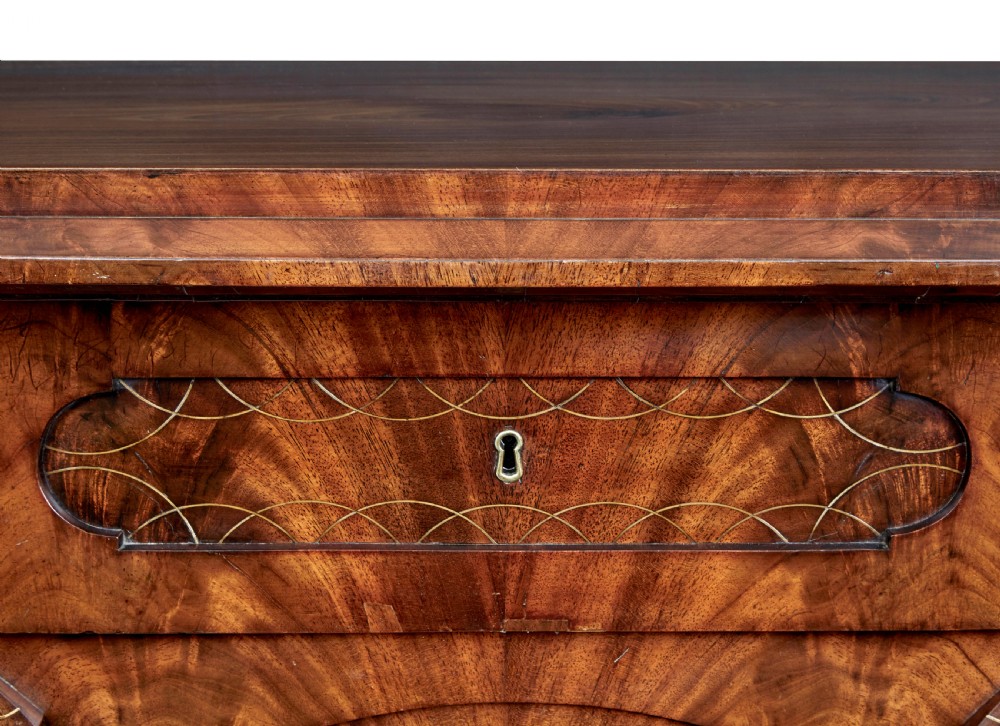 A matching pair of early nineteenth-century mahogany Biedermeier commodes featuring carved cornucopia motifs and side columns. View IX