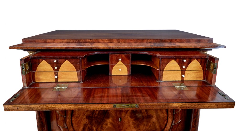 A matching pair of early nineteenth-century mahogany Biedermeier commodes featuring carved cornucopia motifs and side columns. View X