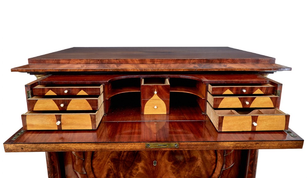 A matching pair of early nineteenth-century mahogany Biedermeier commodes featuring carved cornucopia motifs and side columns. View XI