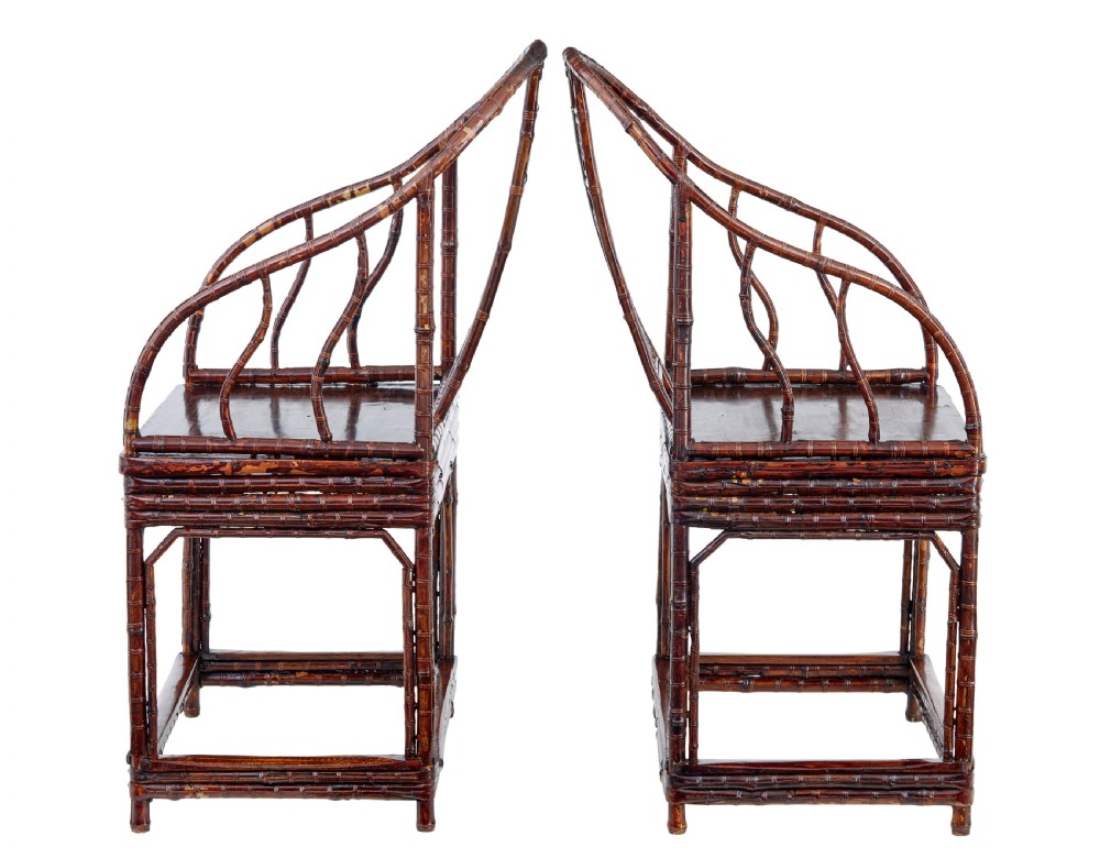 A pair of 19th-century dark brown bamboo armchairs featuring rounded crest rails, geometric lattice splats, and woven panel seats. View VI