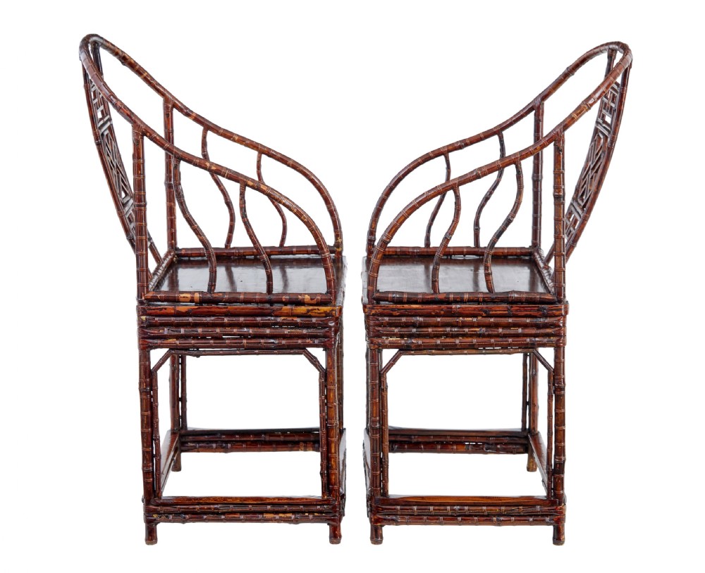 A pair of 19th-century dark brown bamboo armchairs featuring rounded crest rails, geometric lattice splats, and woven panel seats. View VII