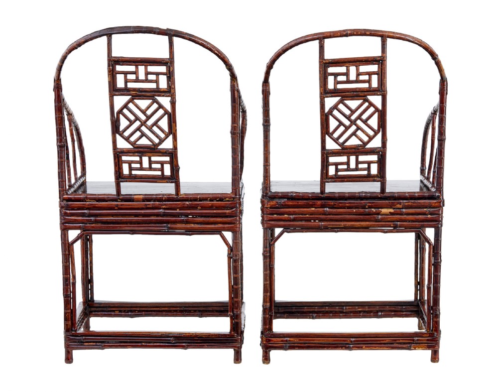 A pair of 19th-century dark brown bamboo armchairs featuring rounded crest rails, geometric lattice splats, and woven panel seats. View VIII