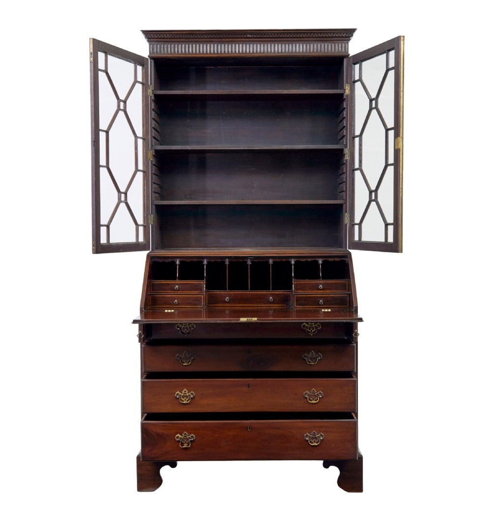 An early nineteenth-century mahogany bureau bookcase featuring upper astragal glazed doors, a slant fall-front writing section, and four graduated lower drawers. View III