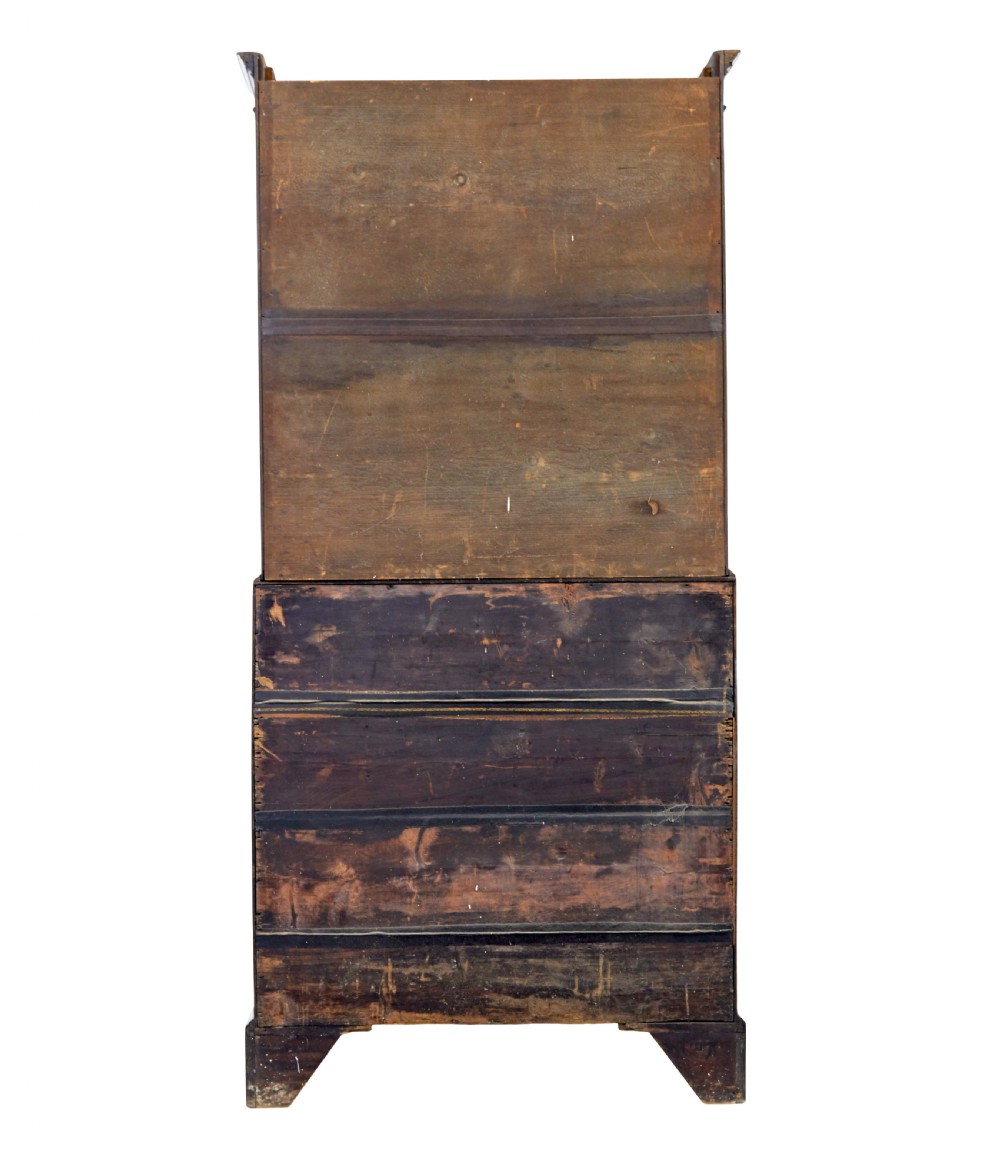 An early nineteenth-century mahogany bureau bookcase featuring upper astragal glazed doors, a slant fall-front writing section, and four graduated lower drawers. View V