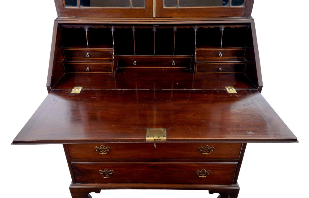 An early nineteenth-century mahogany bureau bookcase featuring upper astragal glazed doors, a slant fall-front writing section, and four graduated lower drawers. View VII