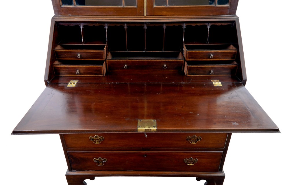 An early nineteenth-century mahogany bureau bookcase featuring upper astragal glazed doors, a slant fall-front writing section, and four graduated lower drawers. View VIII