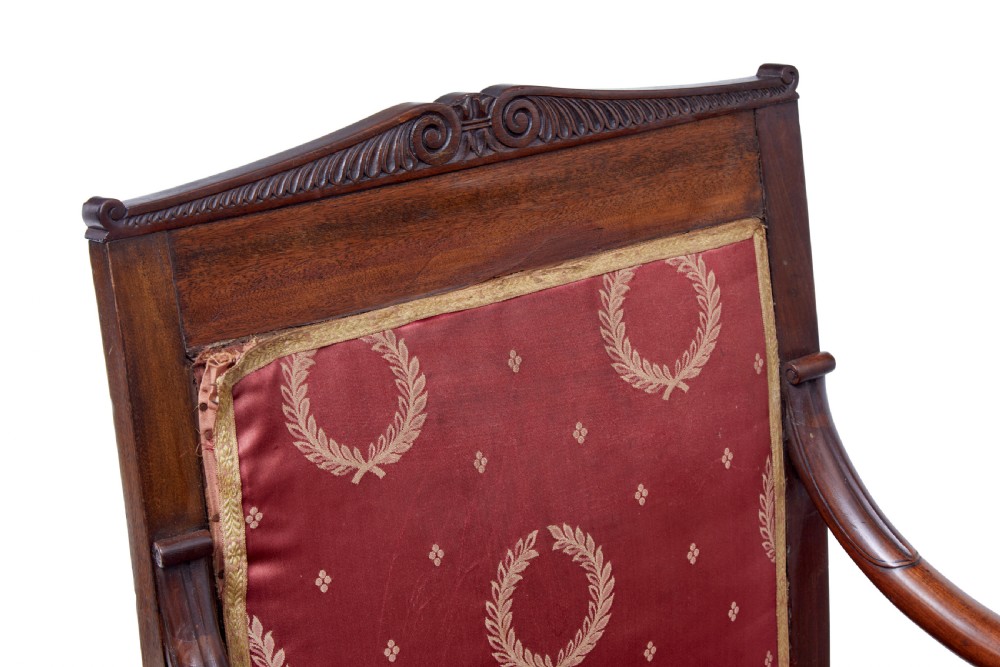 A set of four mid-19th-century Danish mahogany armchairs with scroll arms and red patterned fabric upholstery. View VII