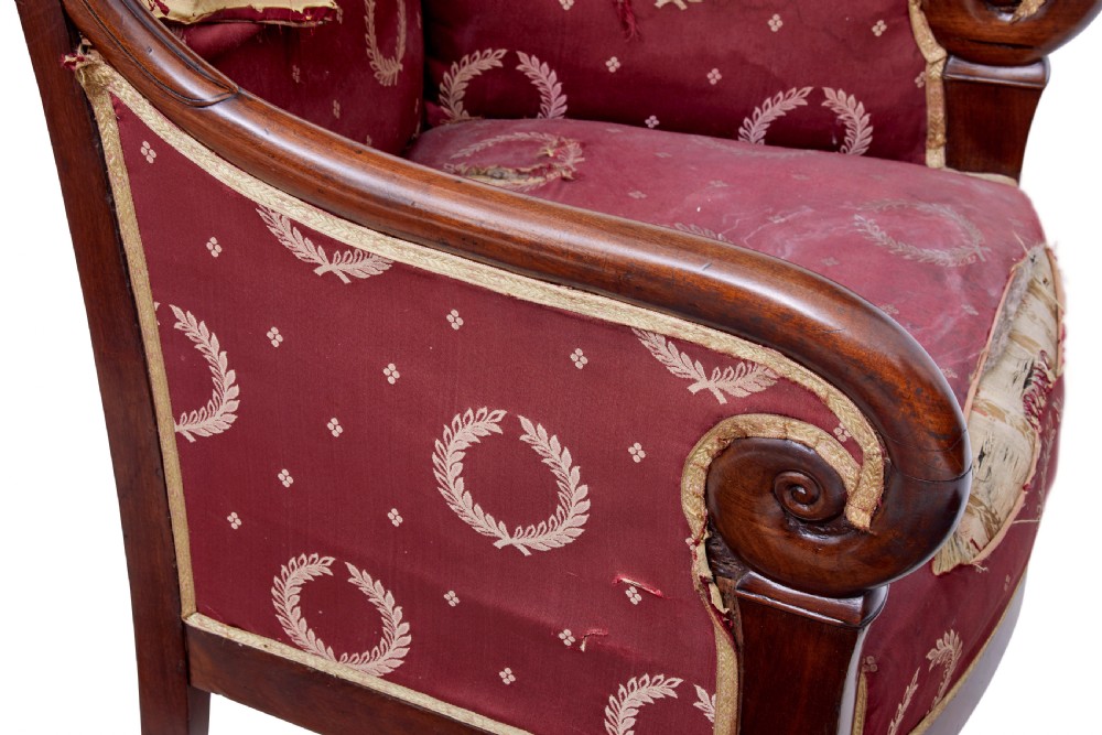 A set of four mid-19th-century Danish mahogany armchairs with scroll arms and red patterned fabric upholstery. View X