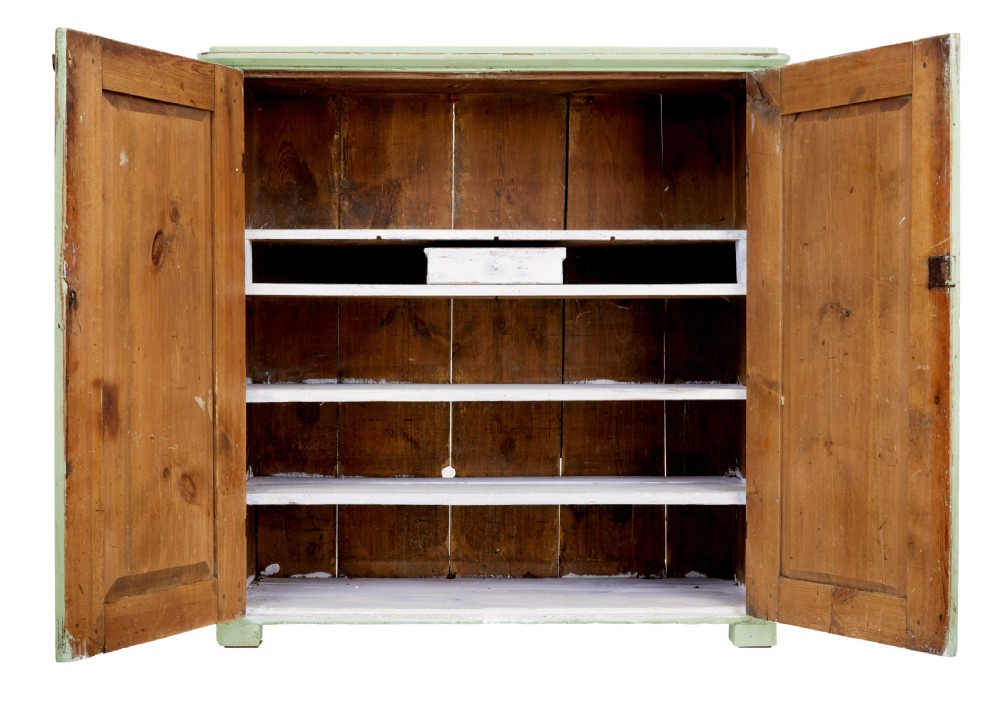 A mid-nineteenth-century Swedish pine cupboard featuring two recessed panel doors painted in distressed pale green with exposed iron hardware. View II