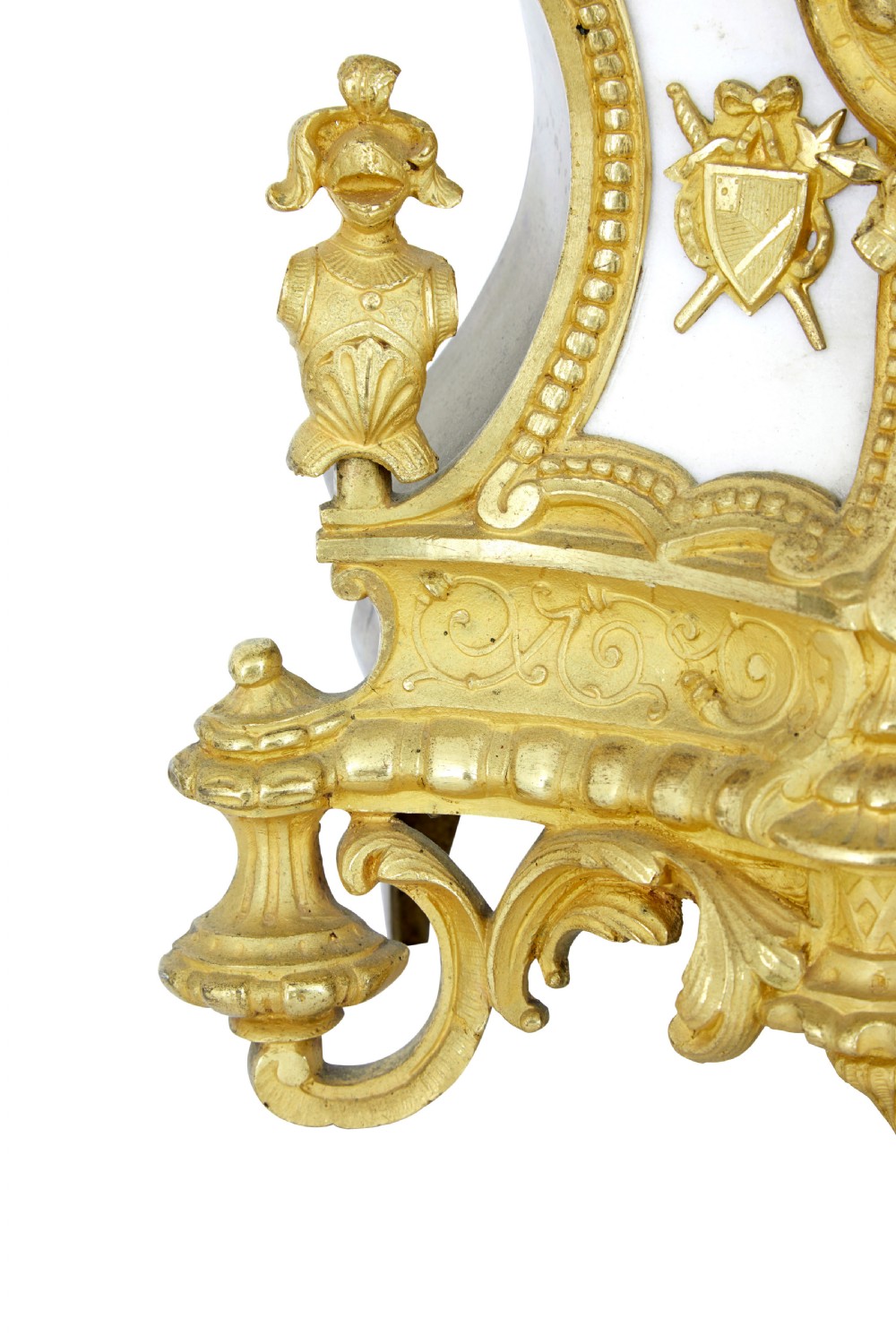 A 19th-century French gilt bronze ormolu mantel clock featuring a knight figure holding a shield and flag above a white enamel Roman numeral dial set into a scrolled base. View VIII