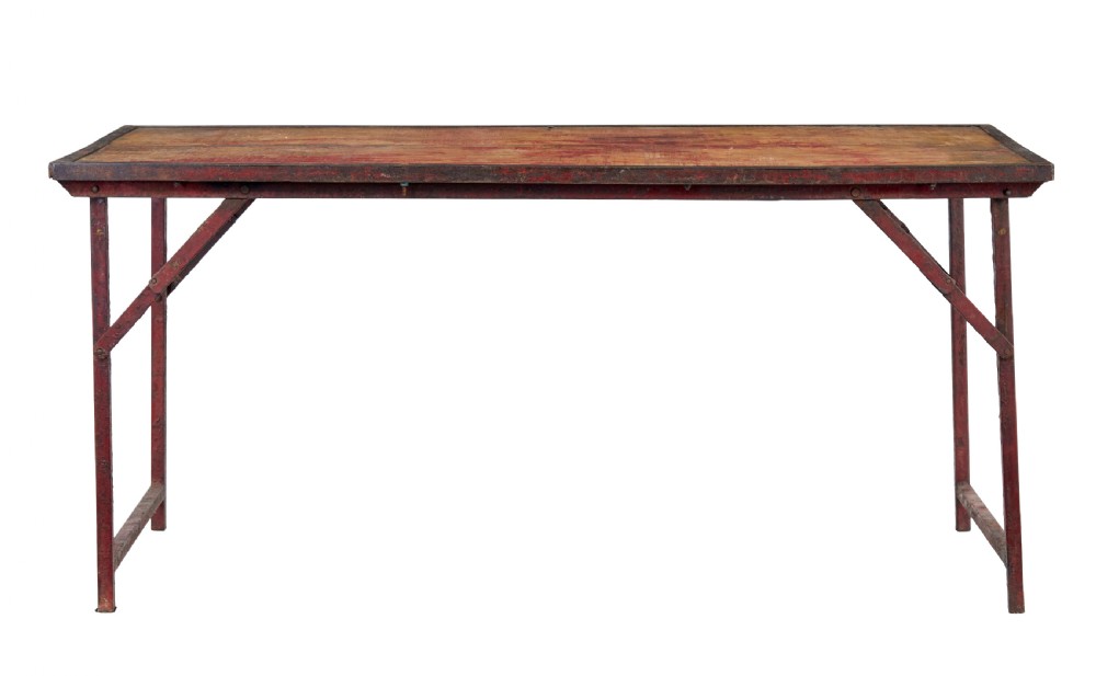A rectangular folding table featuring a weathered wood top set within a distressed red-painted metal frame and leg structure. View III