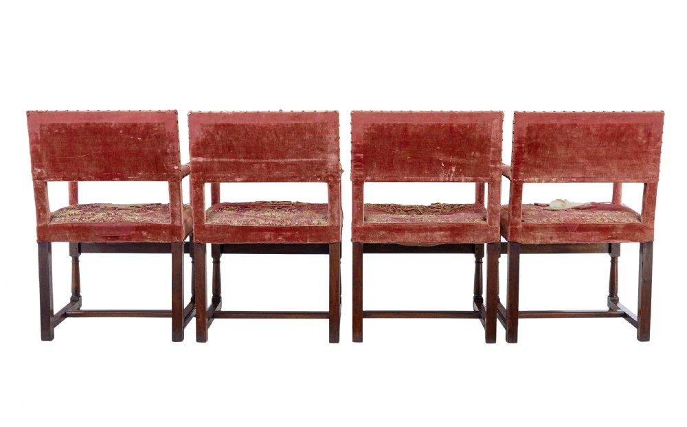 A set of 19th-century carved walnut armchairs with worn red velvet upholstery and embroidered decorative backrest panels. View IV