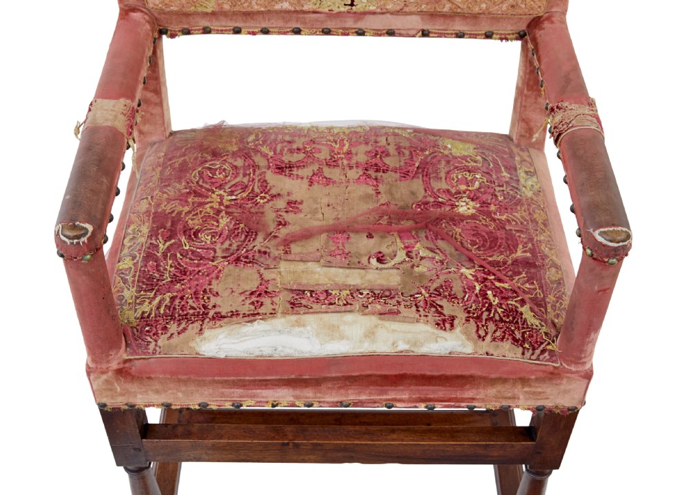 A set of 19th-century carved walnut armchairs with worn red velvet upholstery and embroidered decorative backrest panels. View VII