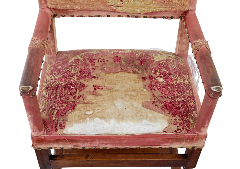 A set of 19th-century carved walnut armchairs with worn red velvet upholstery and embroidered decorative backrest panels. View VIII