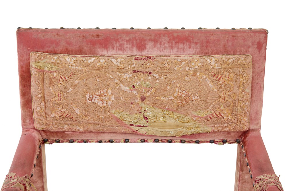 A set of 19th-century carved walnut armchairs with worn red velvet upholstery and embroidered decorative backrest panels. View IX
