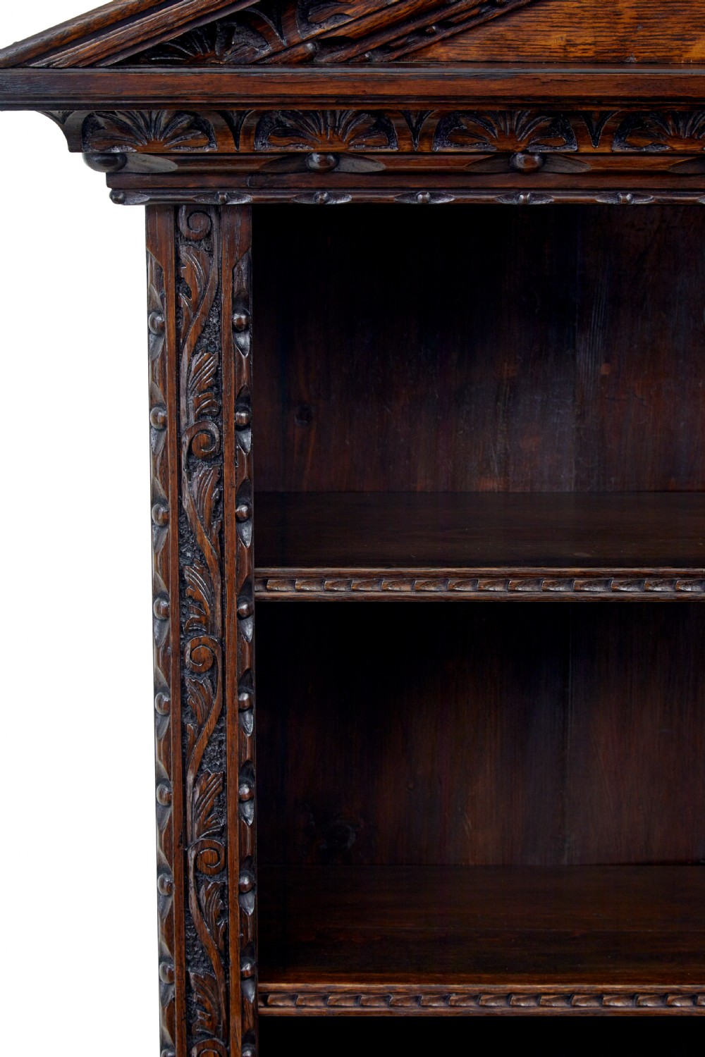 A 19th-century dark oak architectural cabinet featuring an open upper shelf section with a broken pediment crown and lower cupboard doors adorned with floral marquetry inlay. View X
