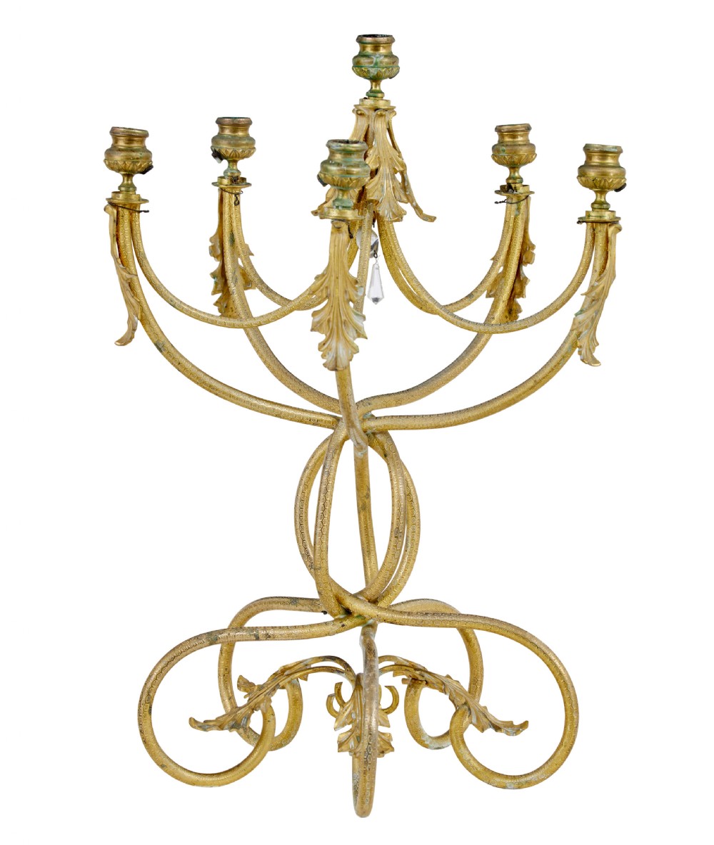 A 19th-century French gilded bronze six-light candelabra featuring curved scroll arms, acanthus leaf embellishments, and a central crystal pendant drop.
