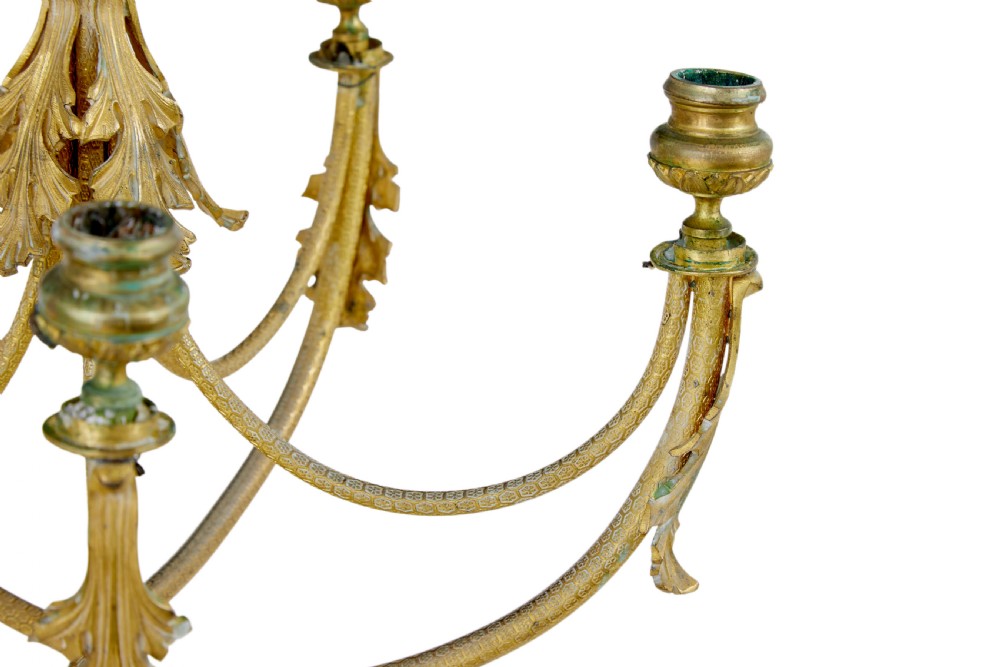 A 19th-century French gilded bronze six-light candelabra featuring curved scroll arms, acanthus leaf embellishments, and a central crystal pendant drop. View VI