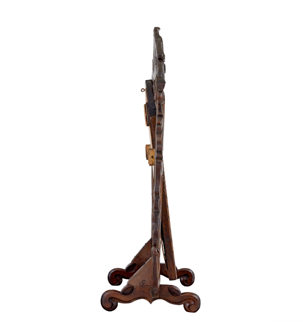 A late 19th-century dark oak tabletop vanity mirror featuring elaborate Rococo Revival scrollwork and an arched frame. View II