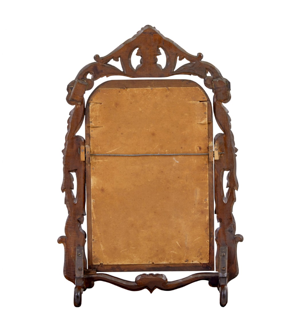 A late 19th-century dark oak tabletop vanity mirror featuring elaborate Rococo Revival scrollwork and an arched frame. View III