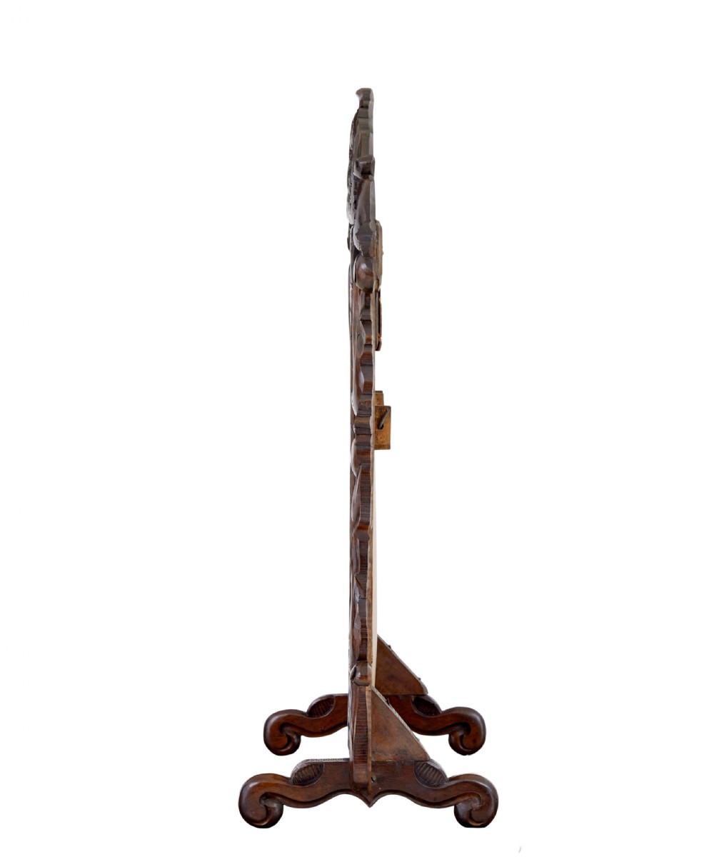 A late 19th-century dark oak tabletop vanity mirror featuring elaborate Rococo Revival scrollwork and an arched frame. View IV