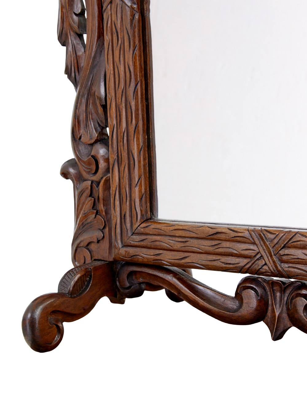 A late 19th-century dark oak tabletop vanity mirror featuring elaborate Rococo Revival scrollwork and an arched frame. View VI