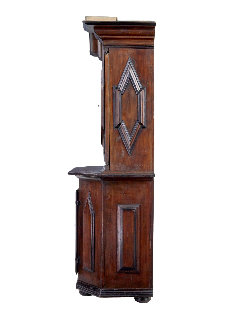 An 18th-century Scandinavian pine Baroque cupboard featuring faceted sides, geometric diamond mouldings on the upper doors, and a projected corniced top. View III