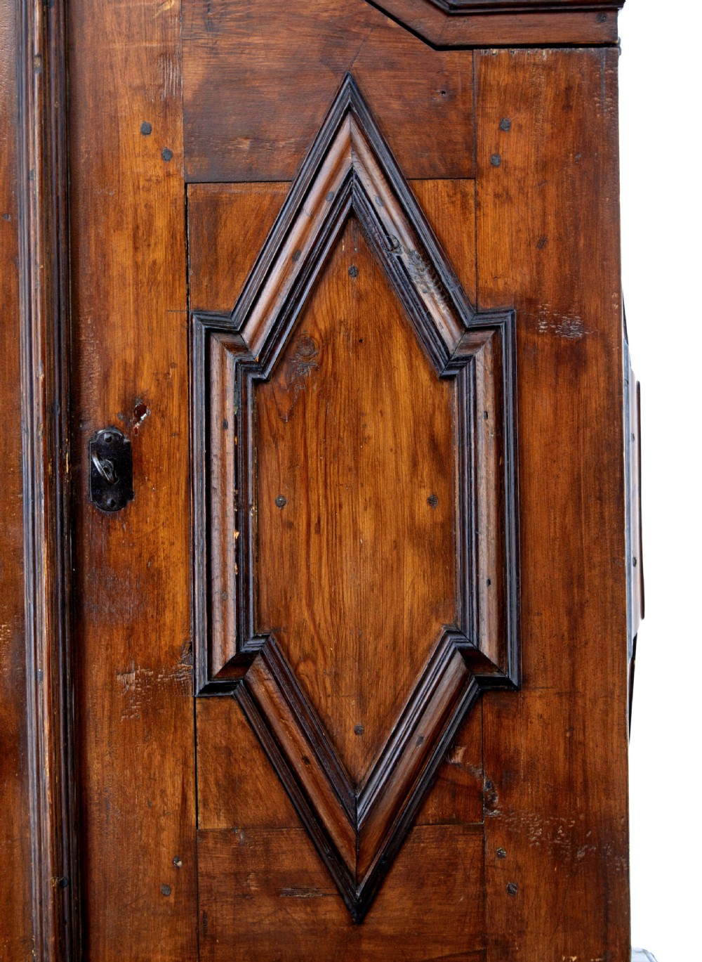 An 18th-century Scandinavian pine Baroque cupboard featuring faceted sides, geometric diamond mouldings on the upper doors, and a projected corniced top. View VIII