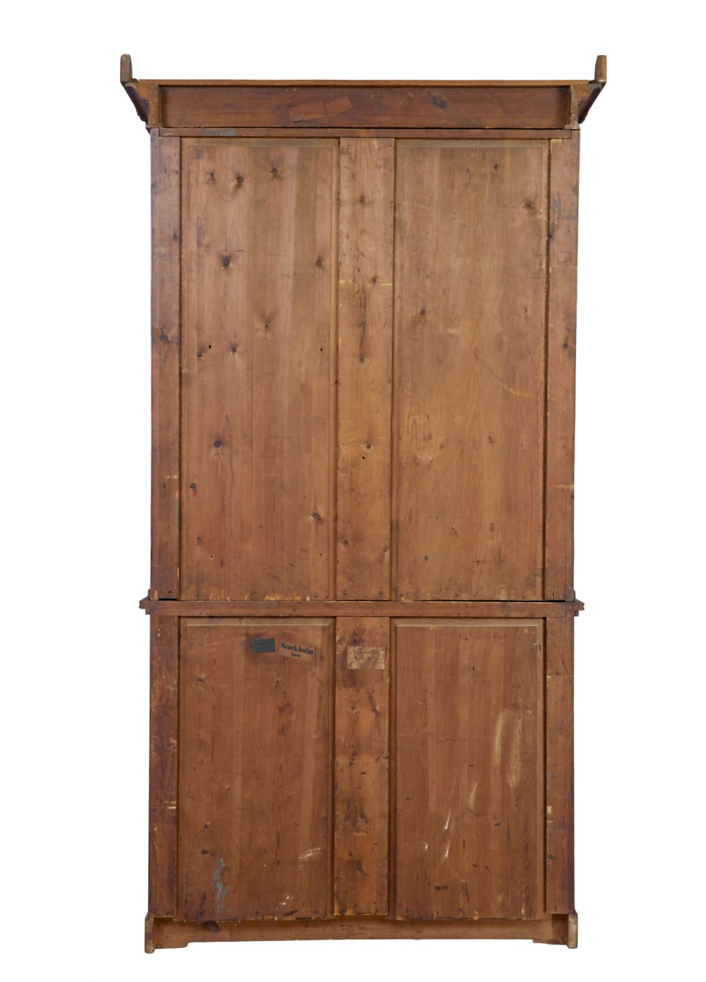 An early 19th-century flame mahogany bookcase featuring a pediment top, two upper glazed doors with arched astragal glazing, and a double-door cupboard base. View V