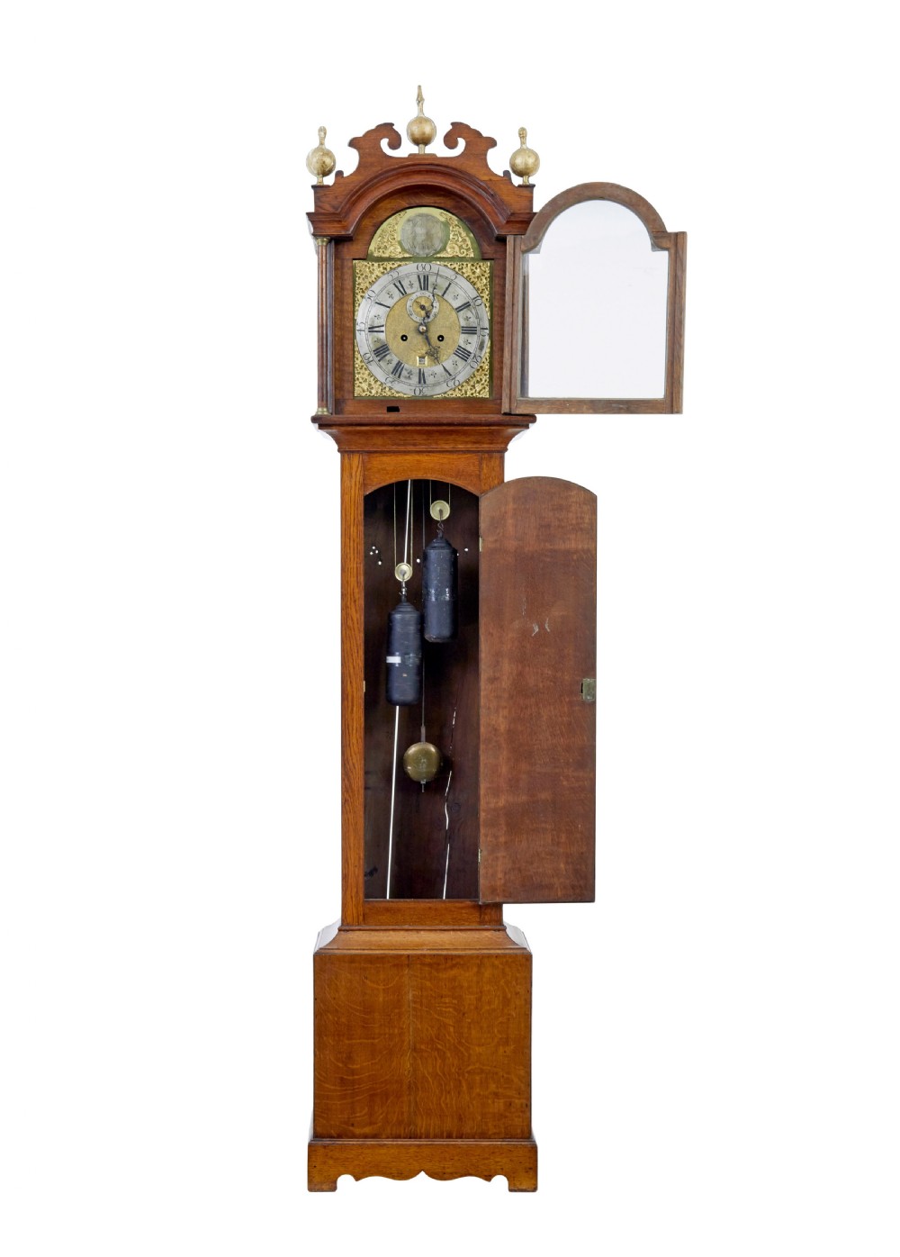 An 18th-century oak longcase clock featuring a brass dial, pediment hood with brass finials, rectangular trunk door, and plinth base. View II